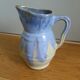 Pastel blue pitcher signed
