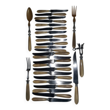 29-piece horn cutlery set, knives and serving utensils.