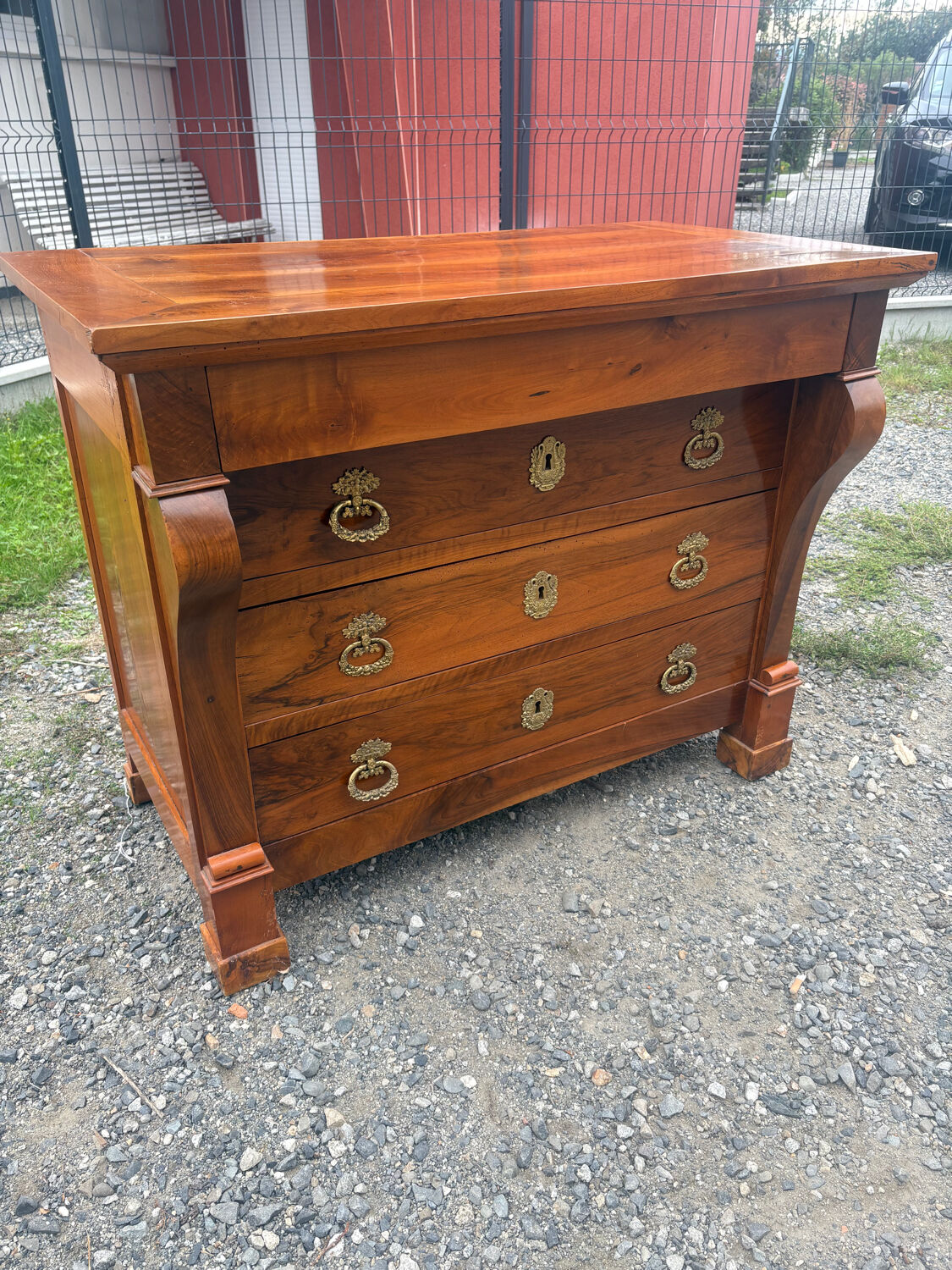 Restoration period walnut chest of drawers with a scroll handle