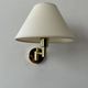 Pair of vintage adjustable wall lights, brass and beige fabric, France, 1970