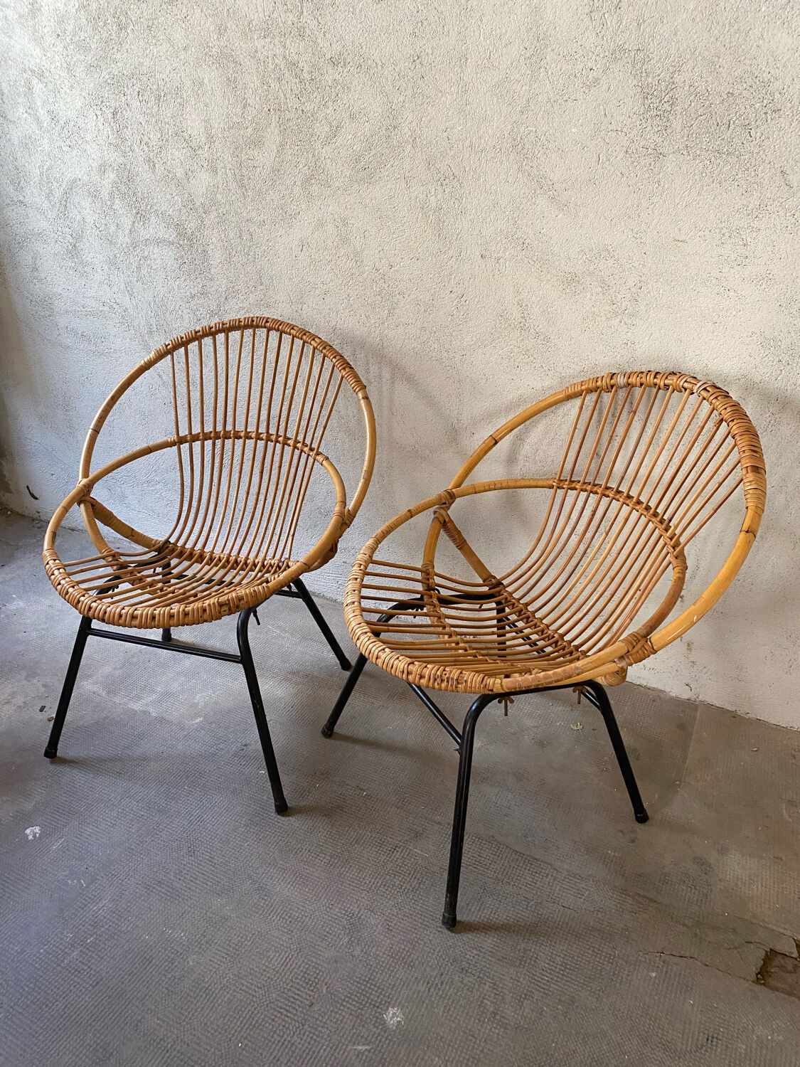 Two rattan armchairs