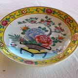 Yellow porcelain plate with saturated and vivid colors. Handmade in Japan