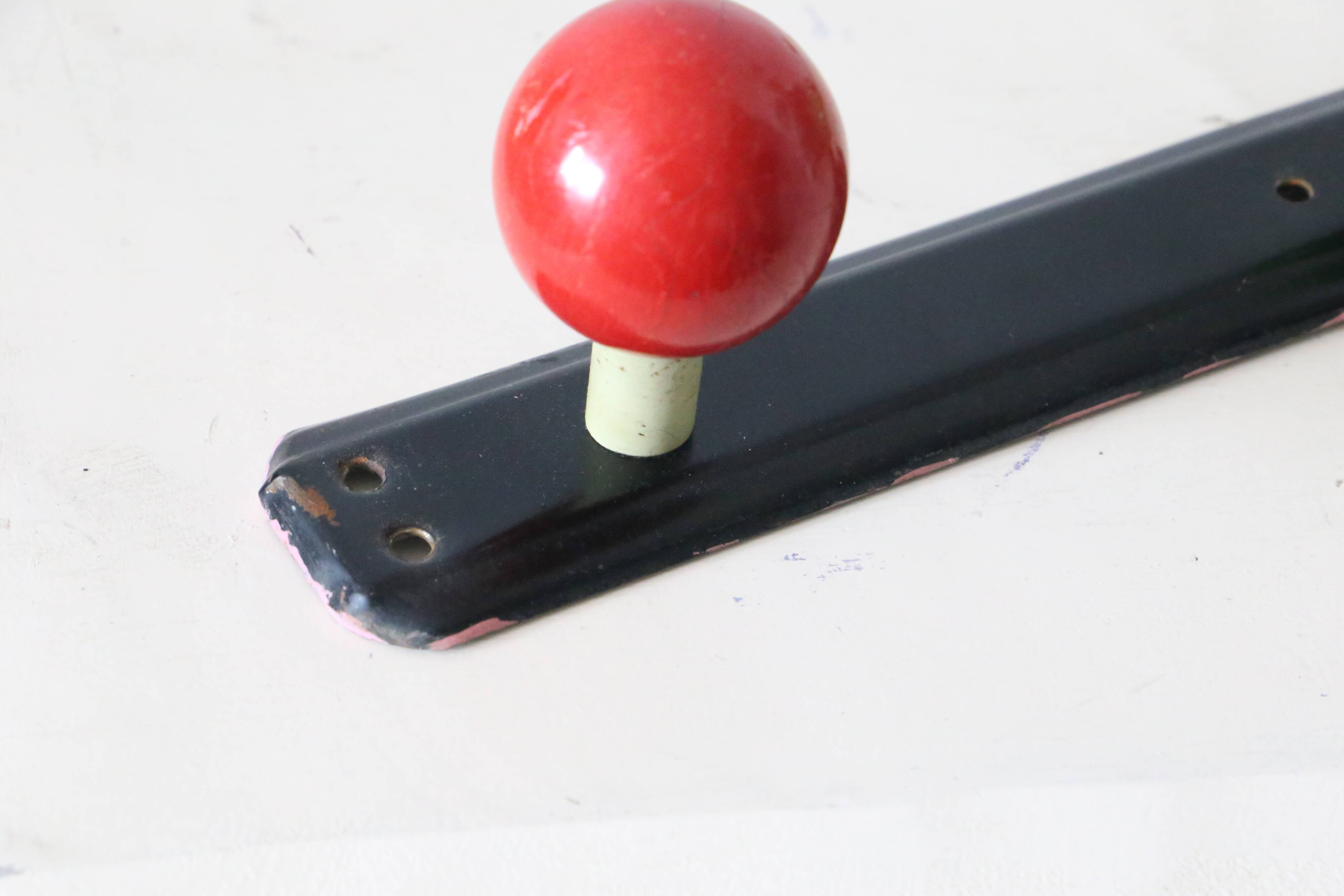 Wall-mounted coat rack, metal and colored wooden hook, 1960