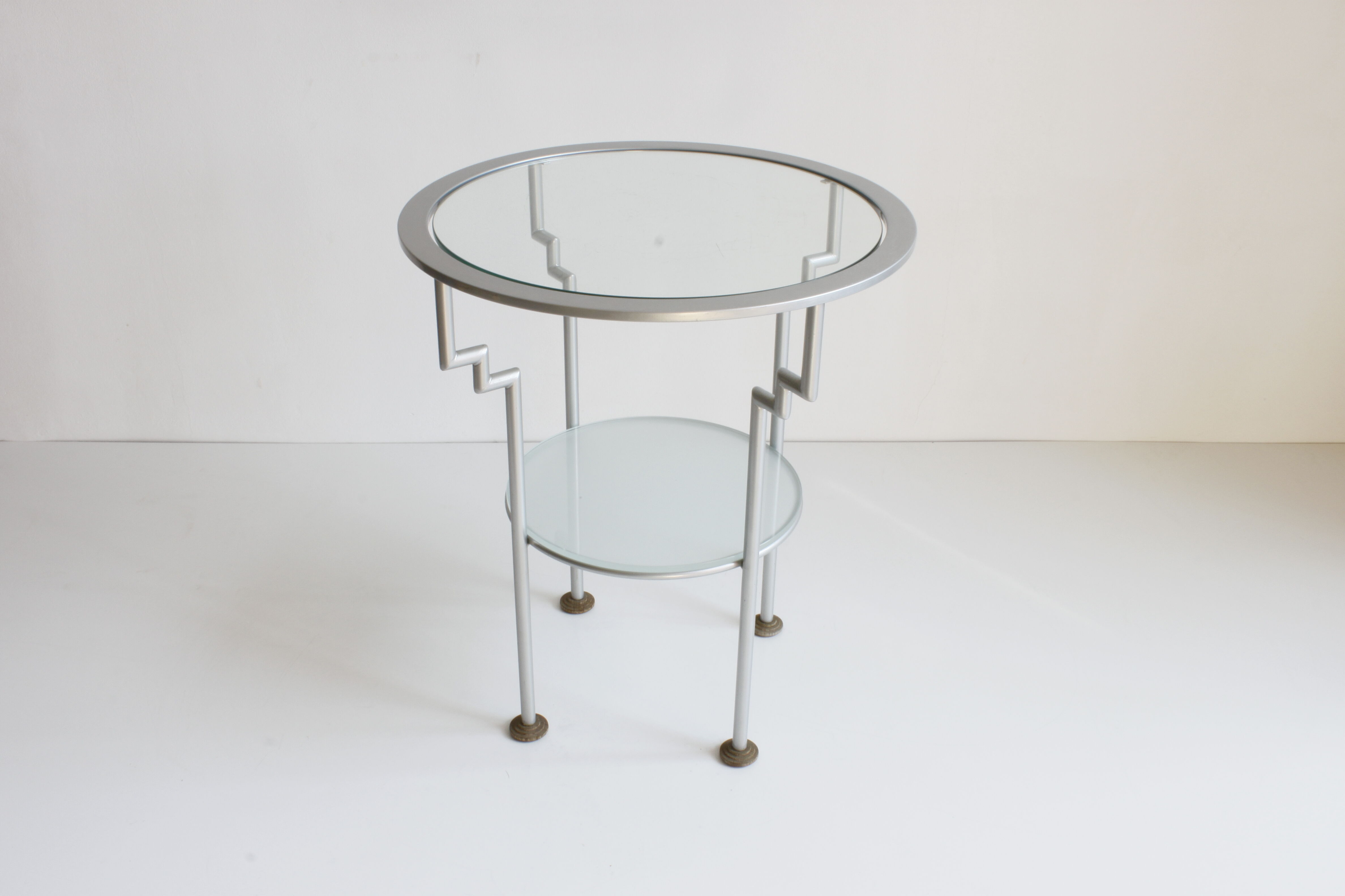 Postmodern round glass  and steel side table, 1980s.