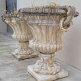 Pair of planter vases decorated with faces in reconstituted stone 1950s