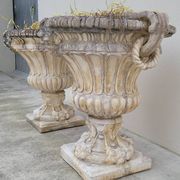Pair of planter vases decorated with faces in reconstituted stone 1950s