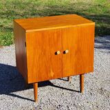 Vintage golden oak sideboard with conical legs from the 1950s