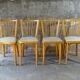 Lot de 4 chaises Baumann bistrot skaï beige 1970 chêne clair