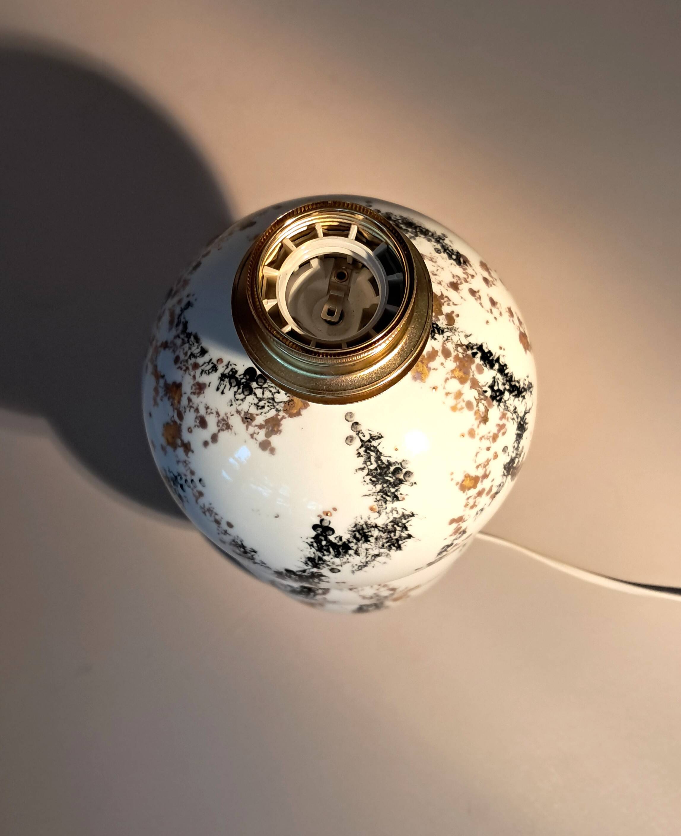 Fine porcelain lamp painted and gilded with fine gold. Laure Selignac, Paris.