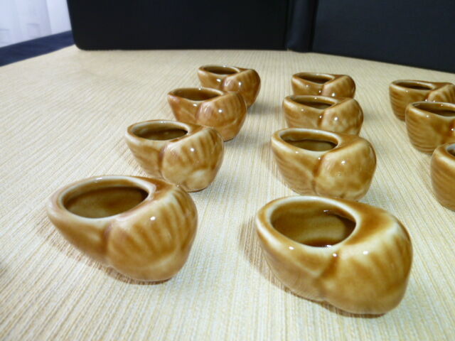 Set of 12 ceramic snail shells