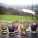 A vintage liqueur service in coloured and gold glass from the 1960s.