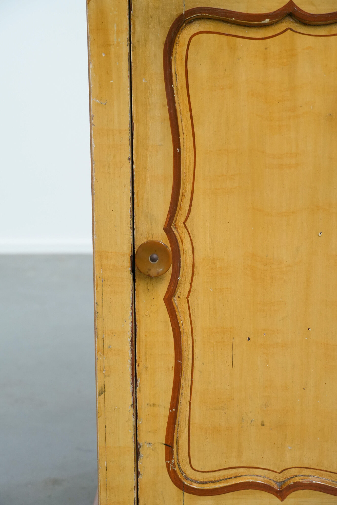 Antique wooden 1-door hallway/nightstand with a light marble top