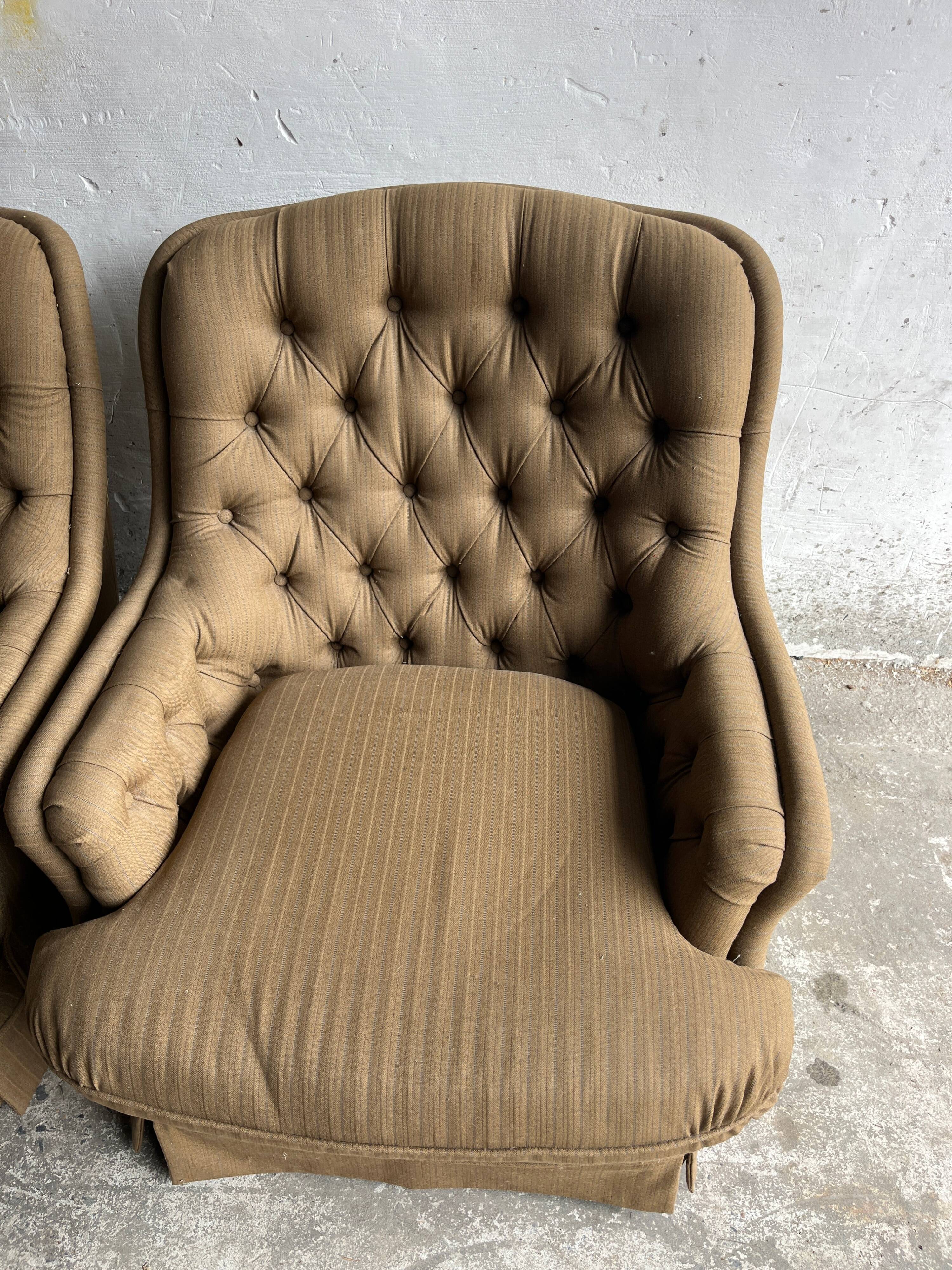 Pair of upholstered lounge chairs with ottoman, 1970s
