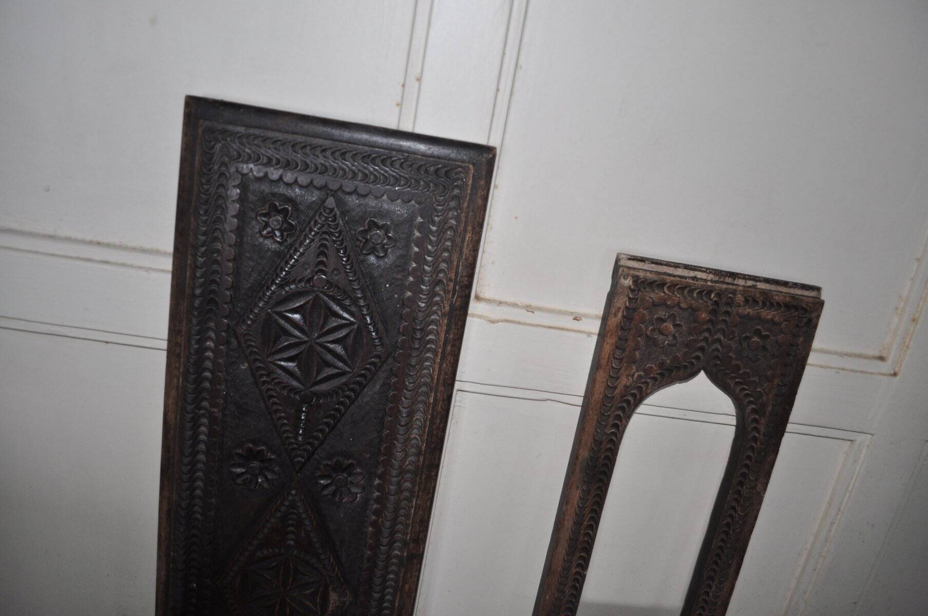 Set of 2 carved brown wooden panels, rural Hungary, 1940s, geometric patterns.