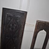 Set of 2 carved brown wooden panels, rural Hungary, 1940s, geometric patterns.