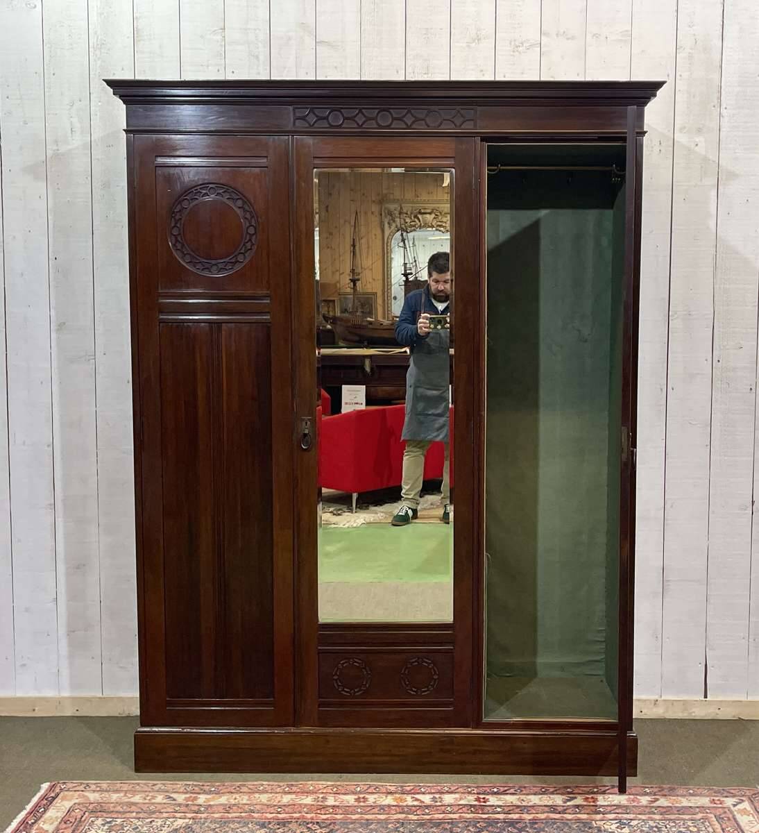 19th-century English mahogany three-door wardrobe.