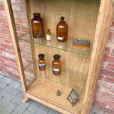 Restored antique oak display cabinet with glass shelves.