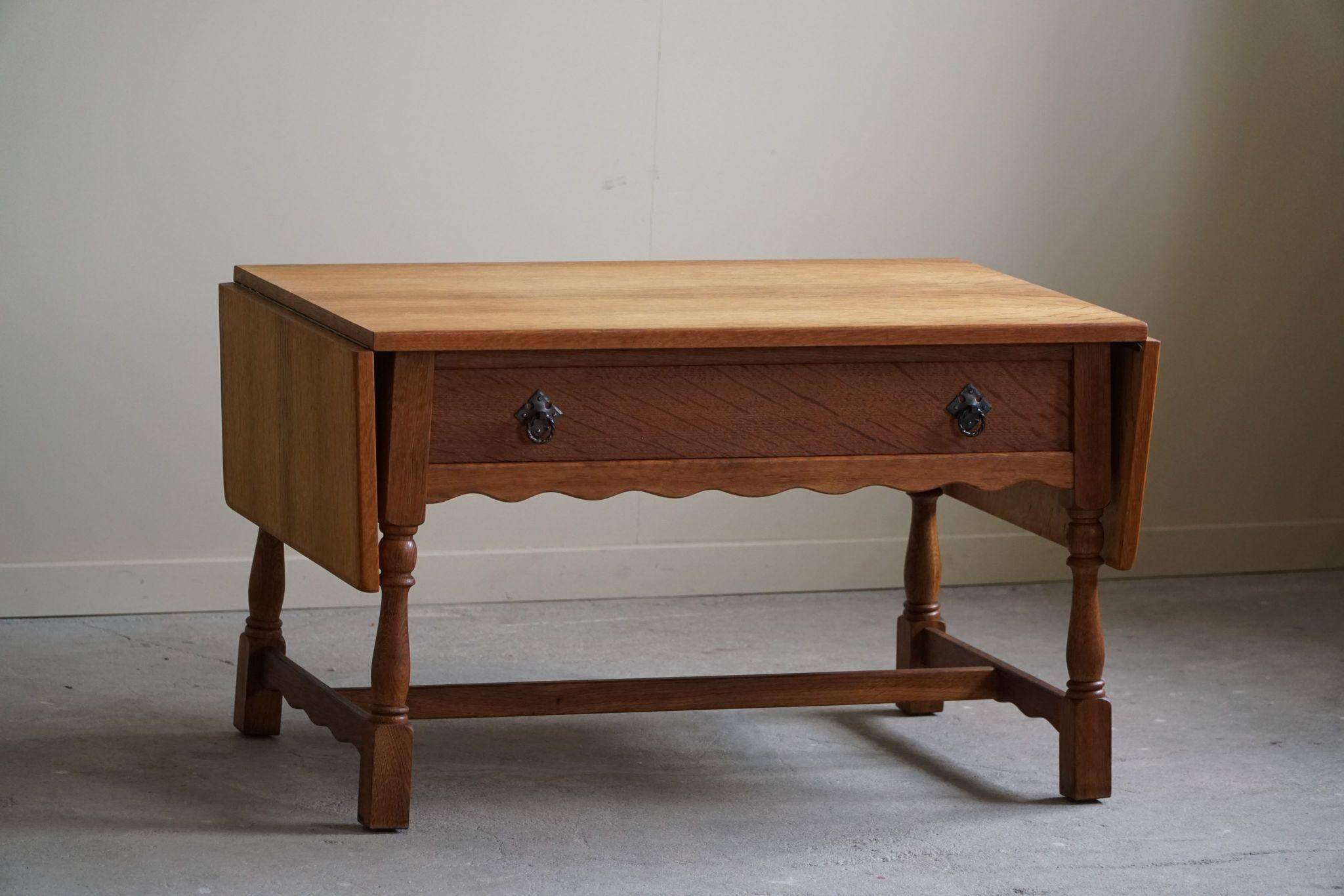 Danish folding table from the mid-century with a drawer in oak, Henning Kjærnulf, 1960s.