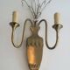 Pair of brass and crystal wall sconces