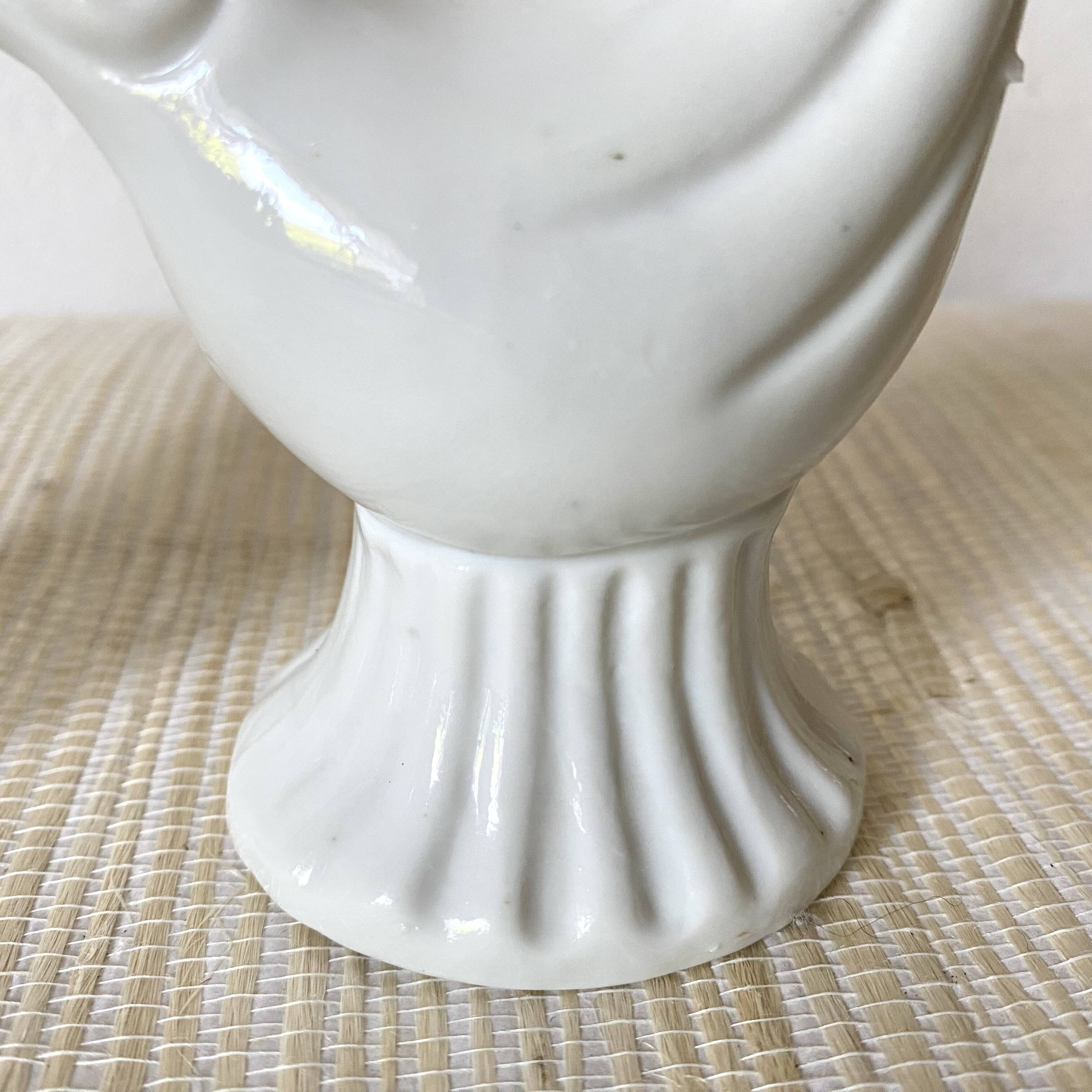Pair of porcelain candle holders and bird vases