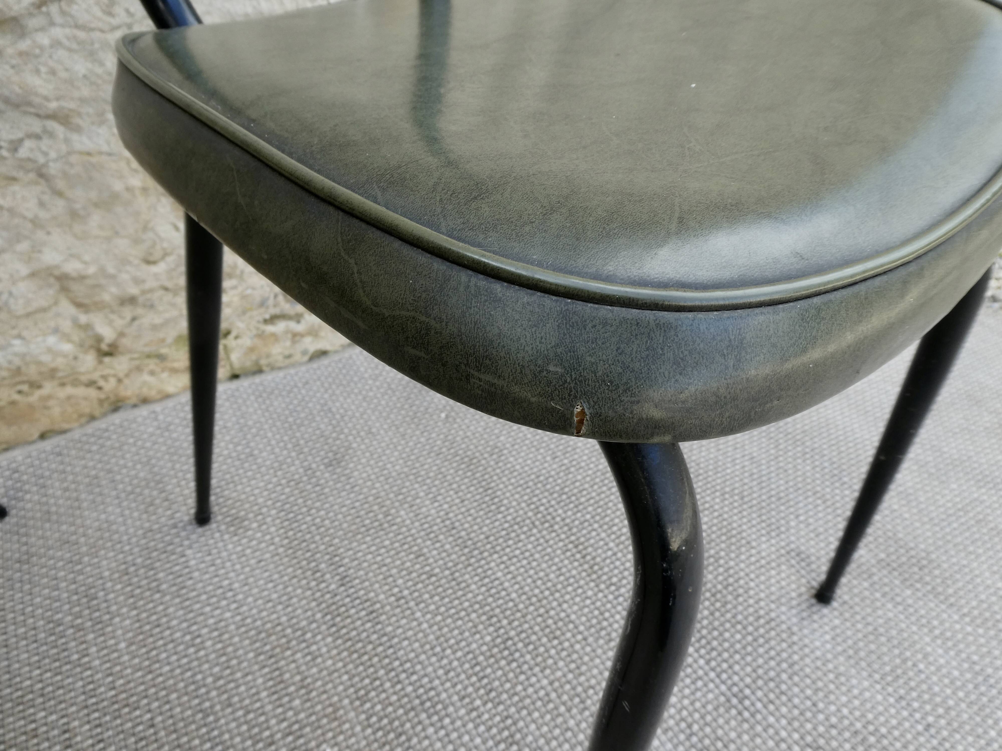 Pair of black metal chairs and khaki green skai, 60s