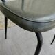 Pair of black metal chairs and khaki green skai, 60s