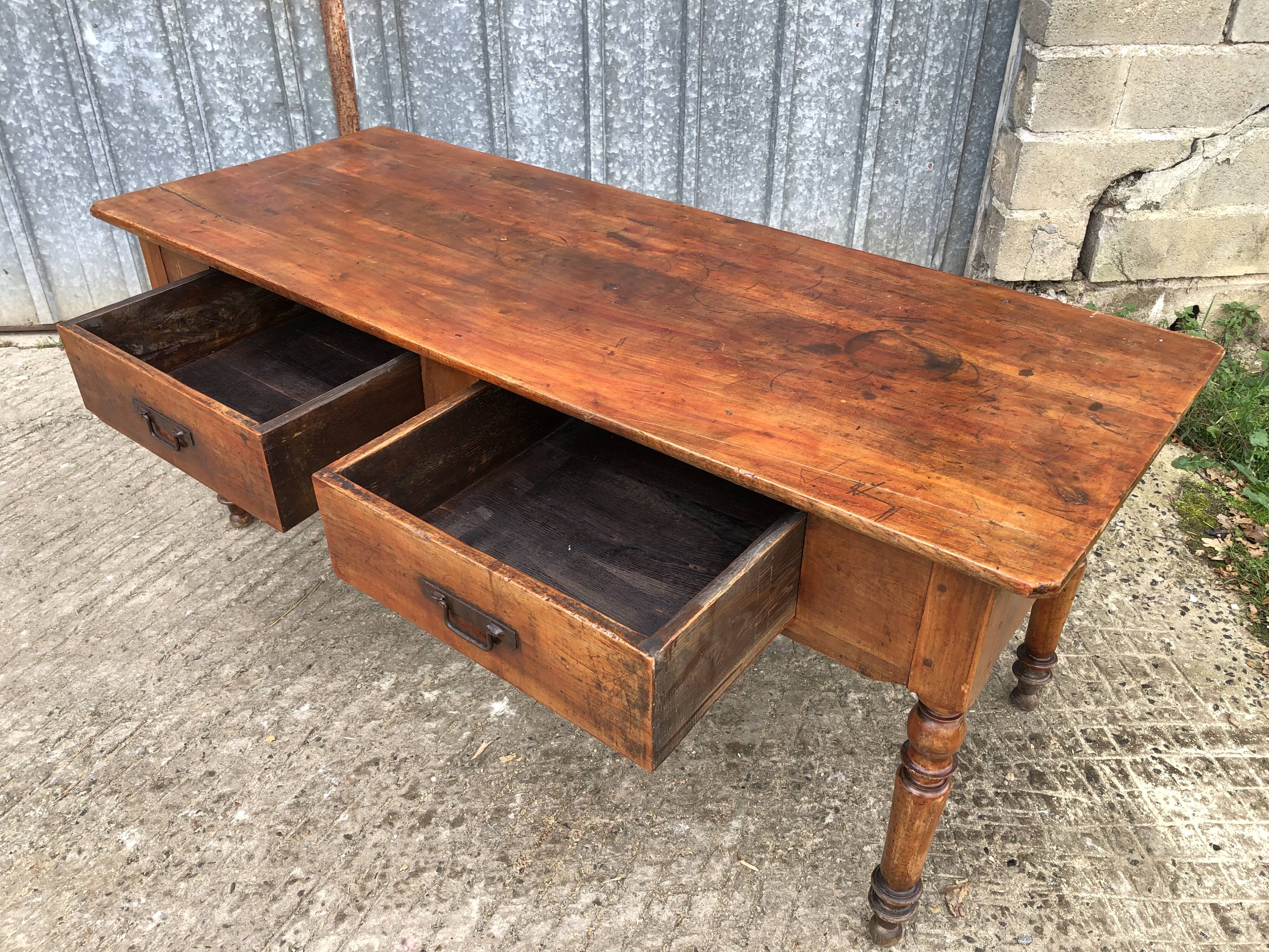Old farmhouse table in solid cherry wood with 2 front drawers.