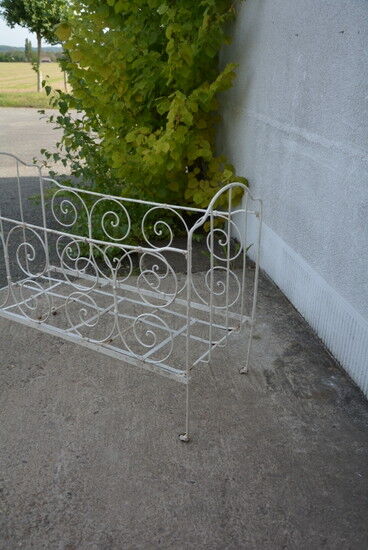Old white wrought iron child bed