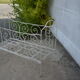 Old white wrought iron child bed