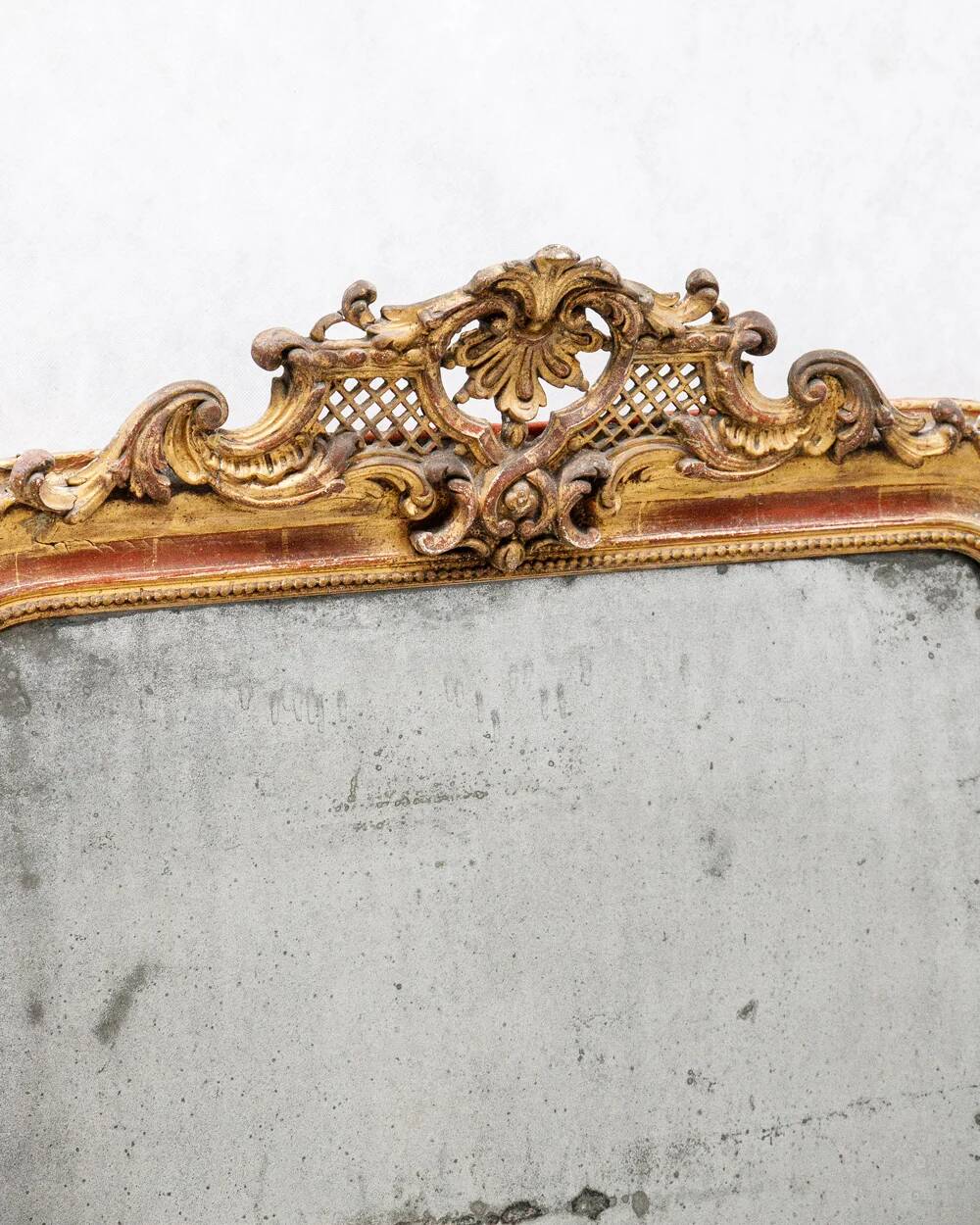 19th-century Louis-Philippe mirror with patina and pediment.