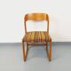 Vintage sled chair by Baumann in wood and wool fabric.