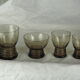 Set de 17 verres fumés noirs sur pied à gravure géométrique - années 70