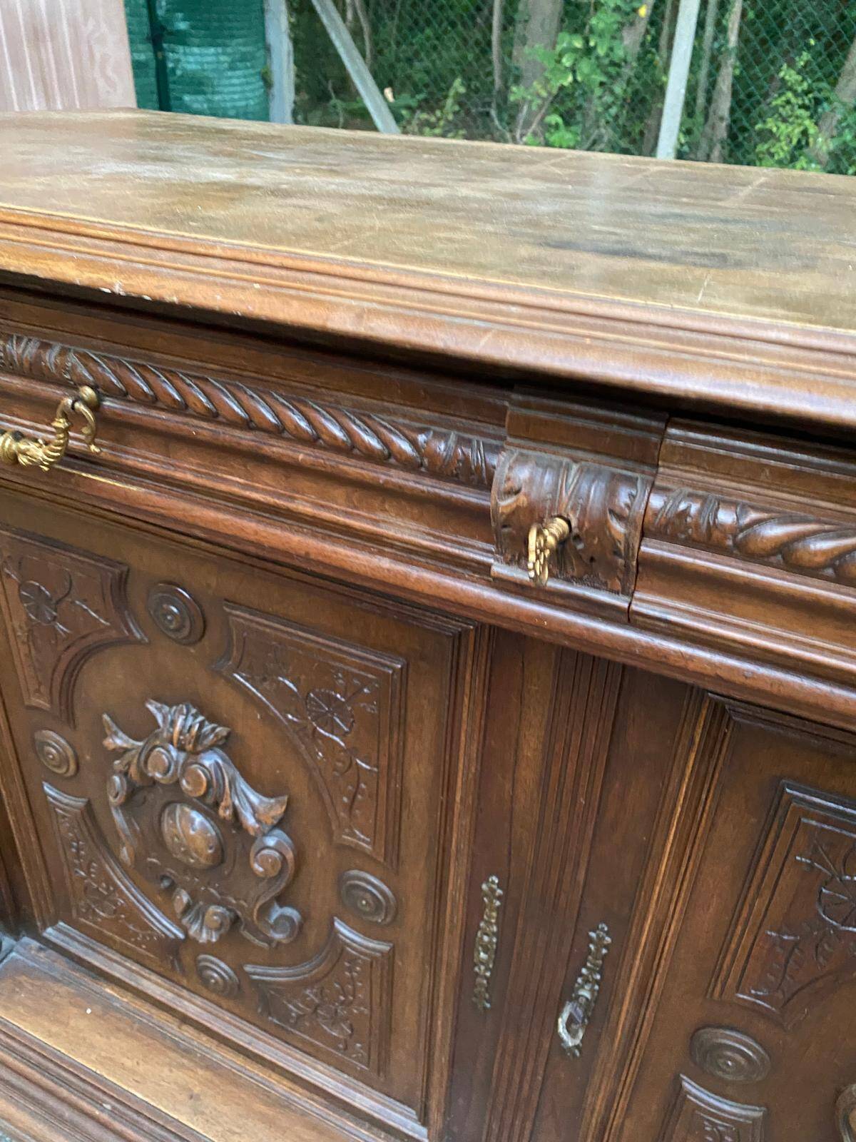 Henri II sideboard in carved wood, 1930.