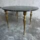 Table basse vintage en marbre noir et laiton