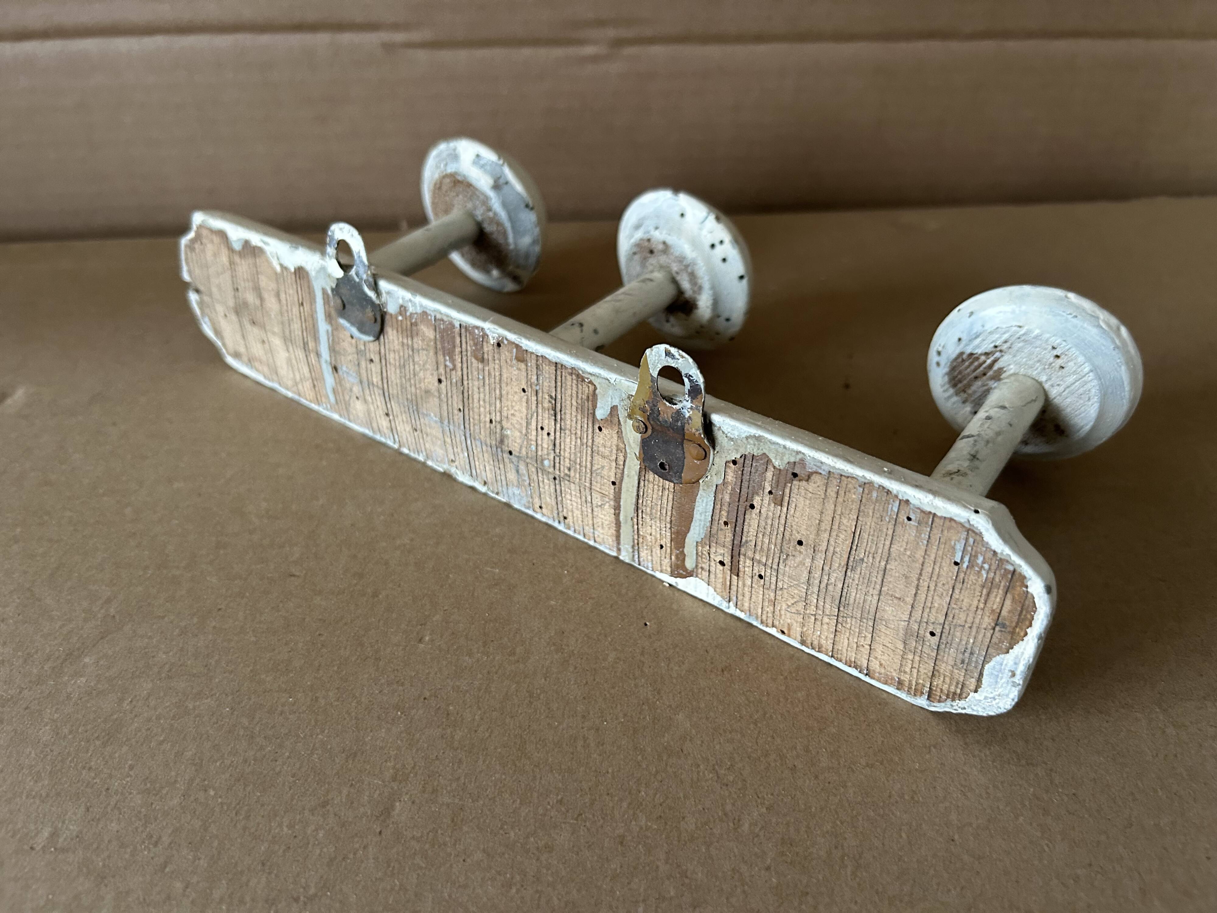 Antique wooden wall-mounted coat rack