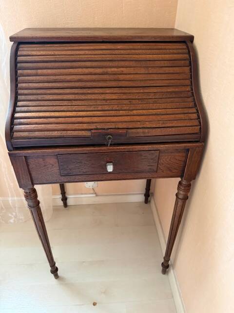 Pretty little secretary with a curtain.