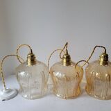 Trio of amber glass pendant lights