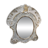 Patinated wooden bull's-eye mirror