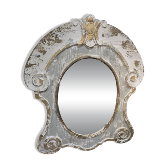 Patinated wooden bull's-eye mirror