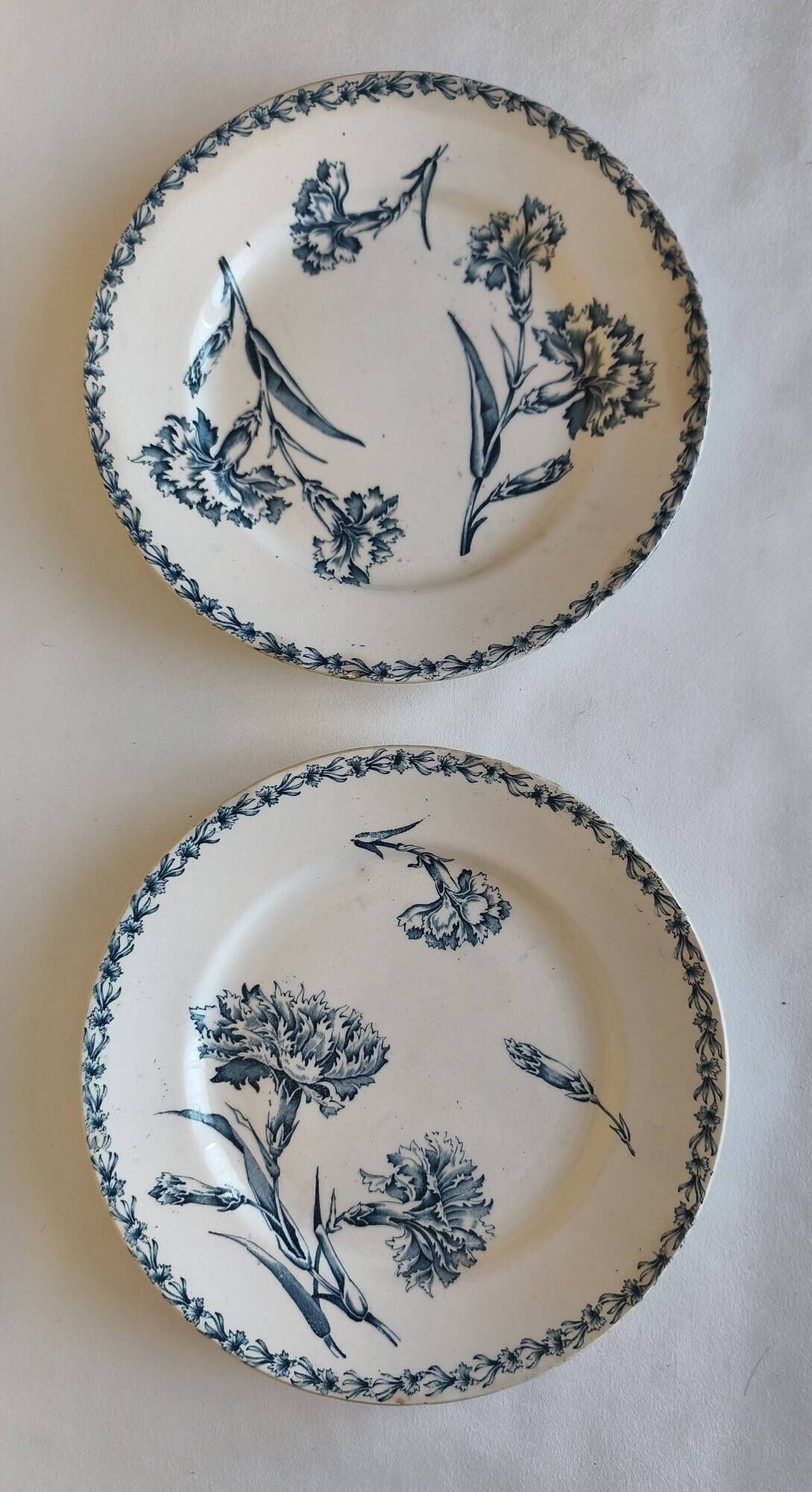 Two ironstone plates from Lunéville Keller and Guérin with a floral pattern.