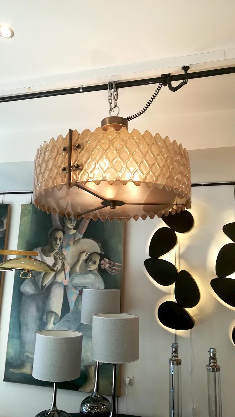 Patinated brass lurstre, and Murano glass