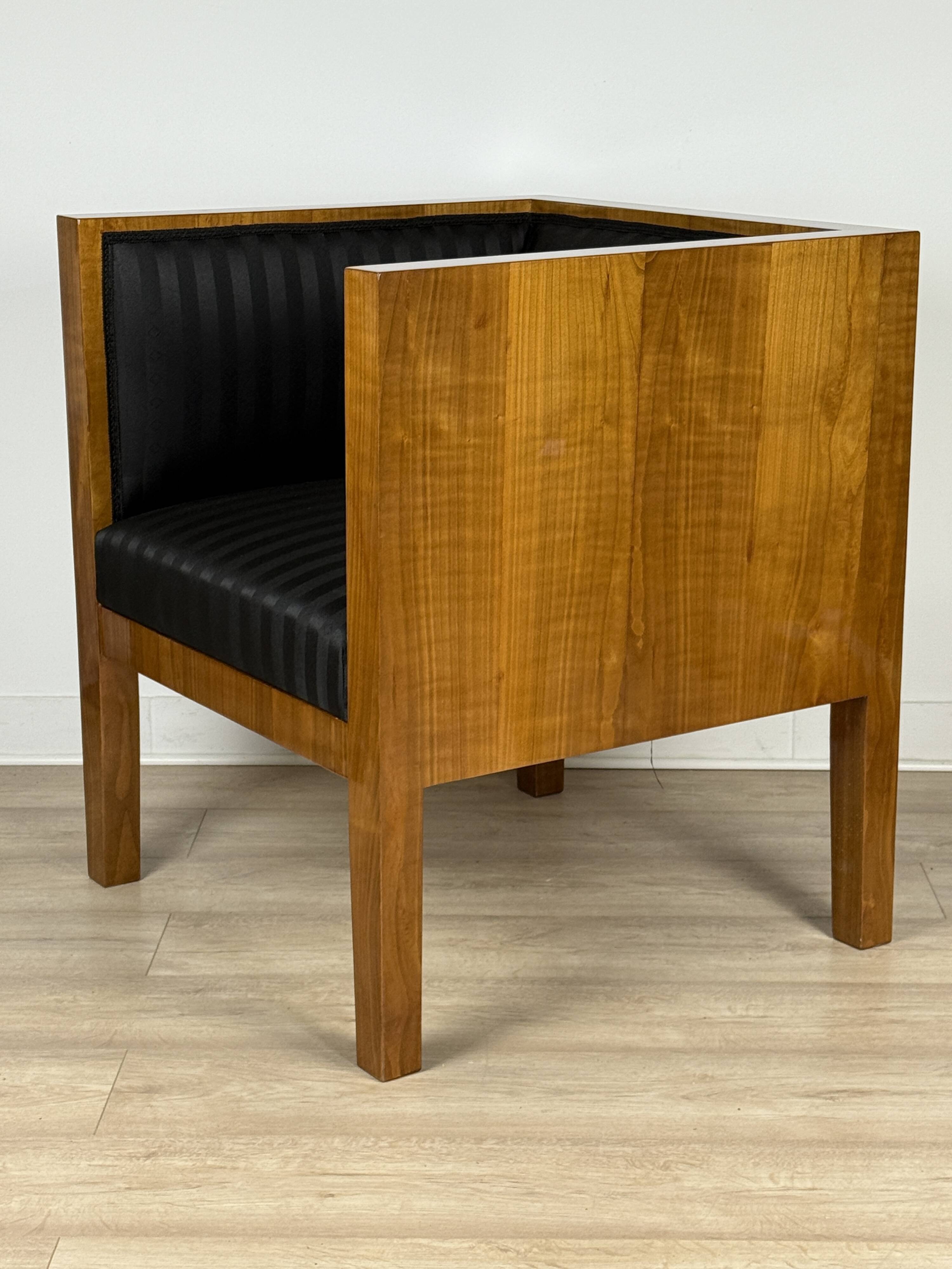 Elegant square-shaped armchair made of natural cherry wood