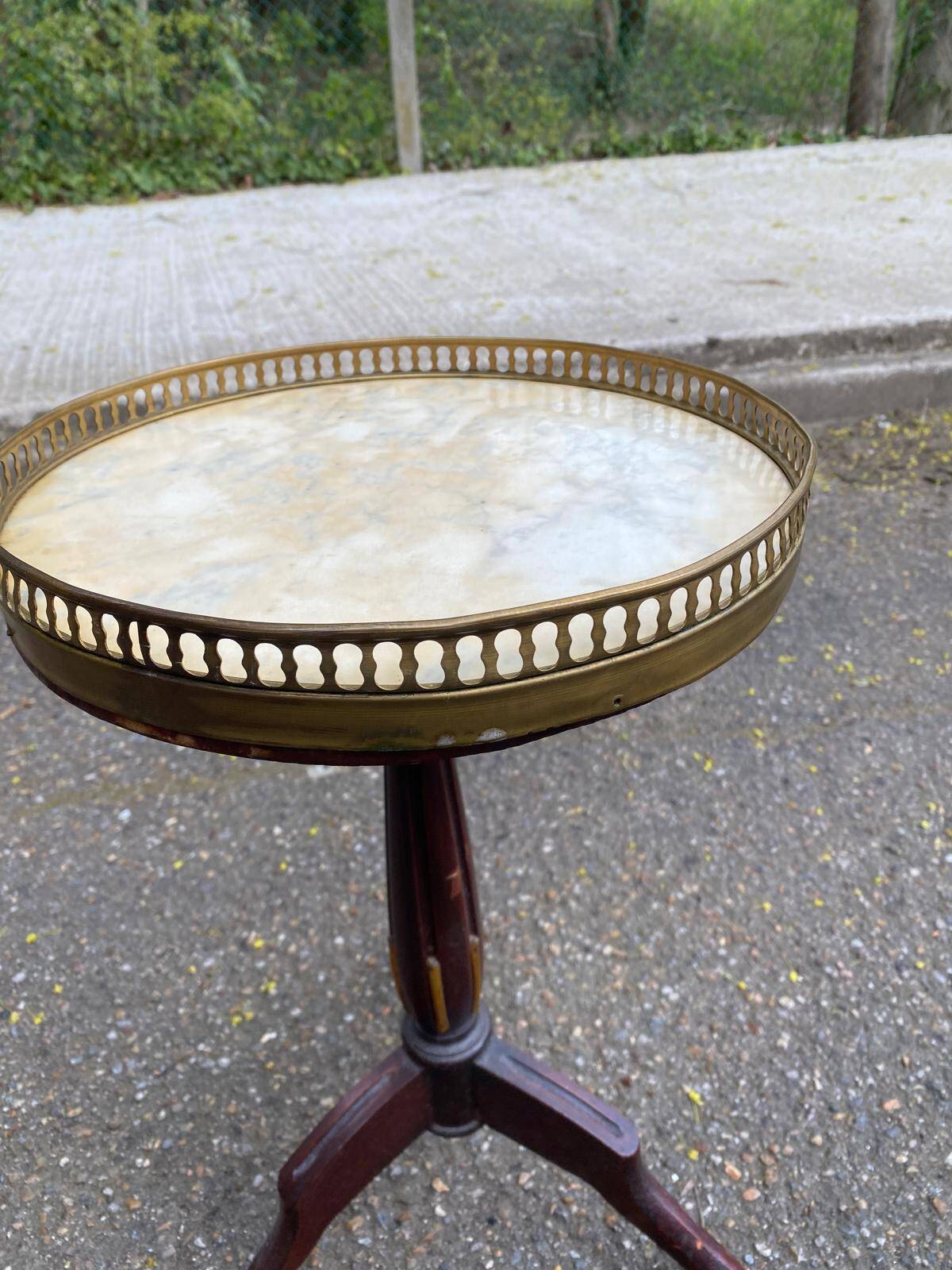 Tripod marble guéridon in gilded Louis XVI style.