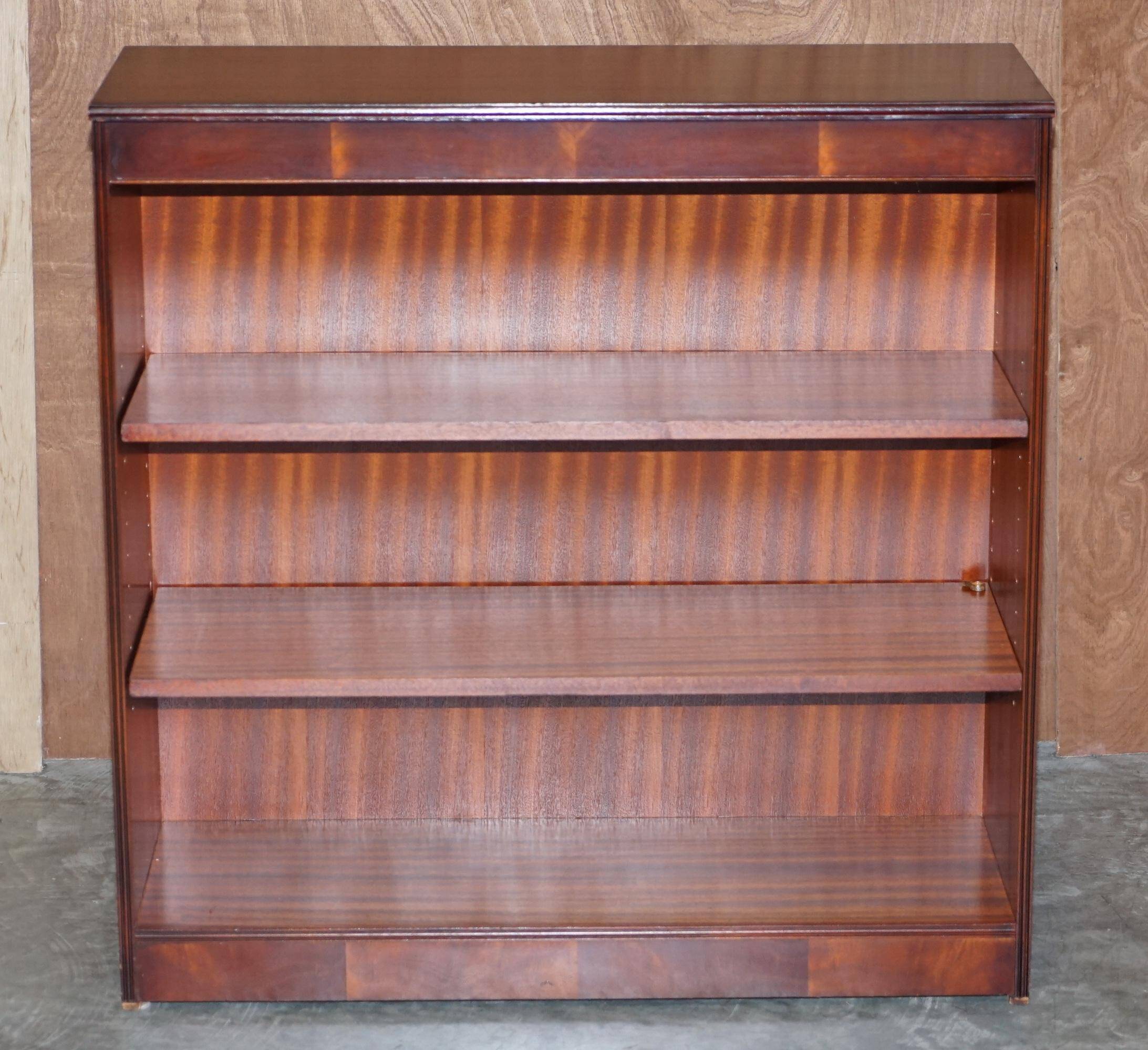 Pair of open low bookshelves Shaws of London in hardwood.