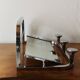 Vintage wall-mounted coat rack in chrome metal with integrated mirror and hat rack