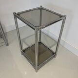 Bolster or end table in chrome steel with smoked window.