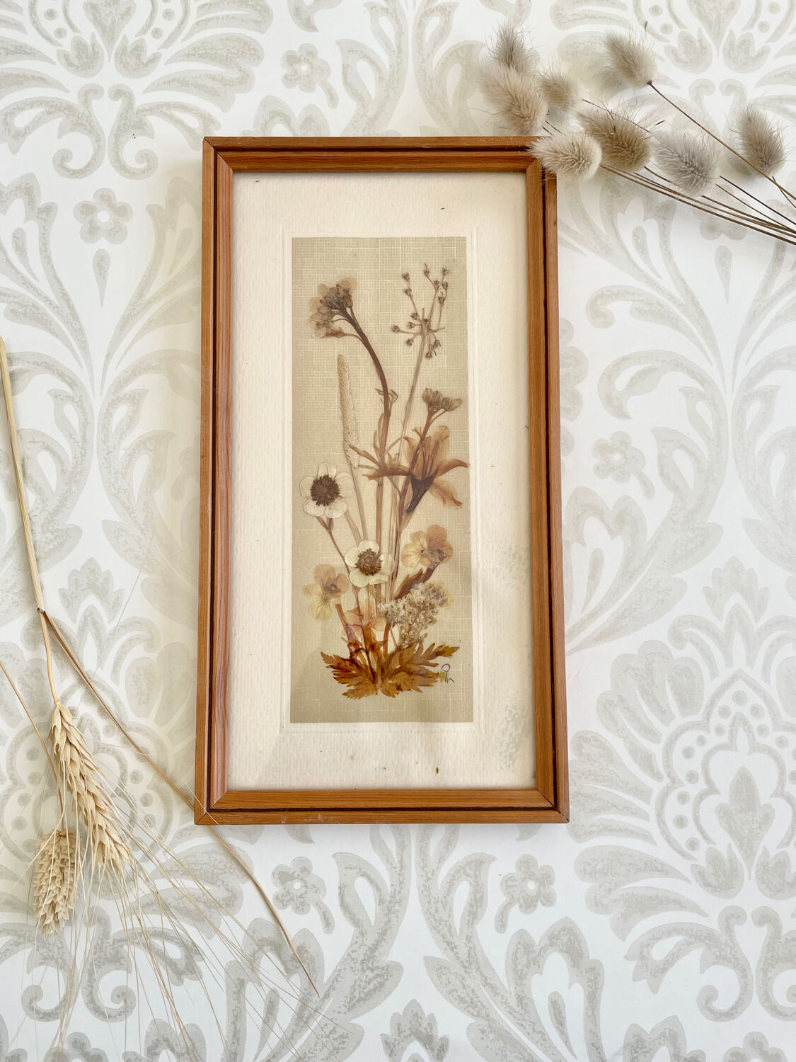 Vintage wood frame dried flowers under glass