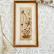 Vintage wood frame dried flowers under glass