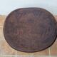 African monoxyle side table in carved wood with a curved top, 48x36 cm.
