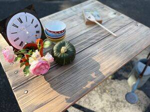 Old table with patinated green legs